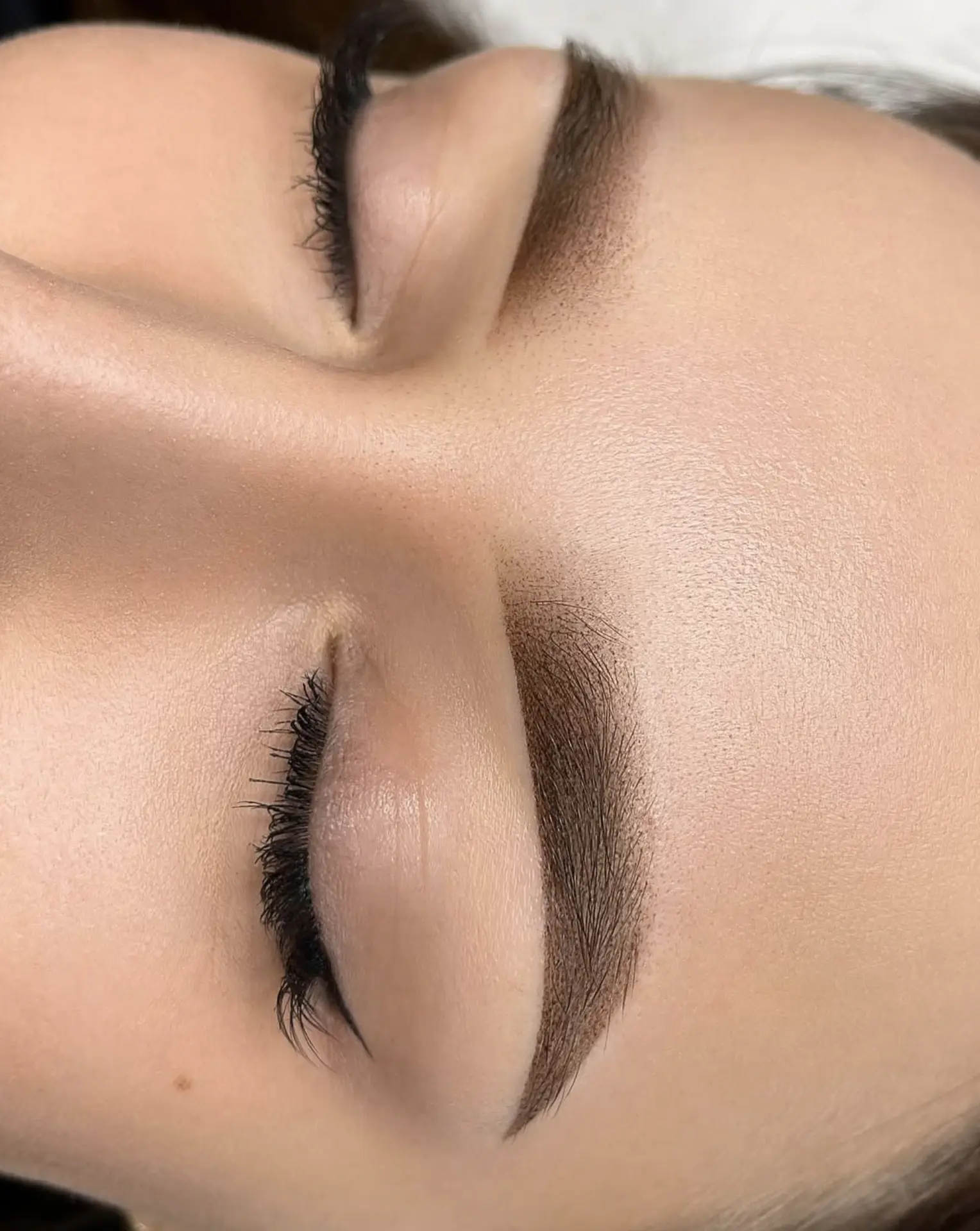 eyebrow feathering tattoo